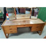 A 1960's lightwood "Uniflex" dressing table with kneehole, triple mirror, 7 drawers and stool