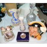 A Dresden figure group: 18th century courting couple; a Royal Doulton character jug "Town Crier" (