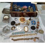 A selection of vintage costume jewellery in a rosewood jewellery box