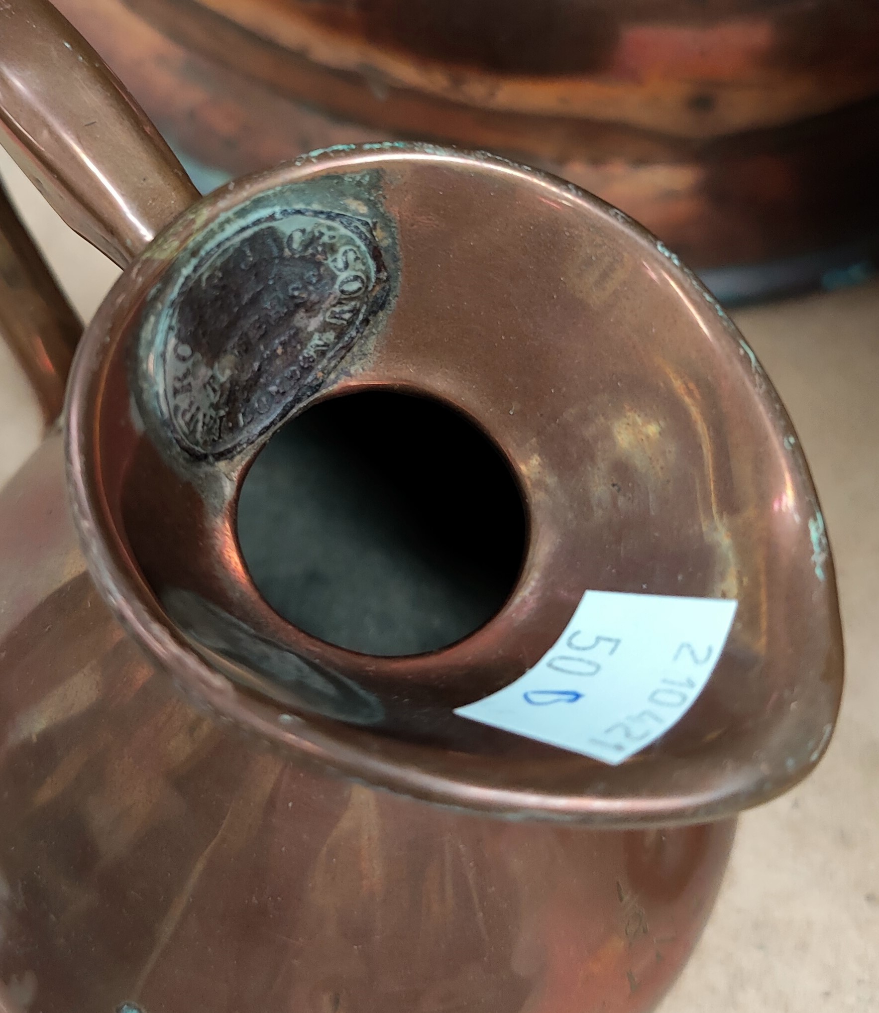 A 19th century matched set of three graduating copper measuring jugs, the smaller of the three - Image 2 of 2