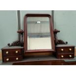 A Victorian dressing table mirror the mahogany frame with carved brackets and 4 drawers