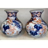 2 imari bulbous vases of squat form with flared neck, decorated with phoenix etc. Height 23cm