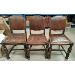 Three oak studded leather effect back dining chairs (one ripped)