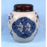 A large Chinese blue and white ginger jar with carved and pierced wooden lid, the body of the jar