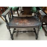 An early 20th century oak stool/window seat