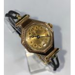 A 1920's ROLEX 9ct gold octagonal cased lady's dress watch with 7 jewelled movement, gilt face with