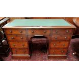 A 19th century mahogany kneehole desk with insets top, 8 pedestal and 1 central drawers, width 120