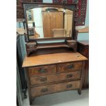 A walnut dressing chest with swing mirror over 2 long and 2 short drawers