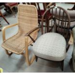 An Ercol style armchair with hoop and stick back; a lightwood and cane armchair