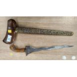 A Malayan presentation Kris, polished wood handle and ornate embossed brass scabbard, with inset