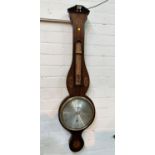 A 1th century mercury column barometer with thermometer in mahogany banjo shaped case with