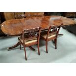 A reproduction Regency mahogany dining suite with wide yew-wood cross banding comprising extending