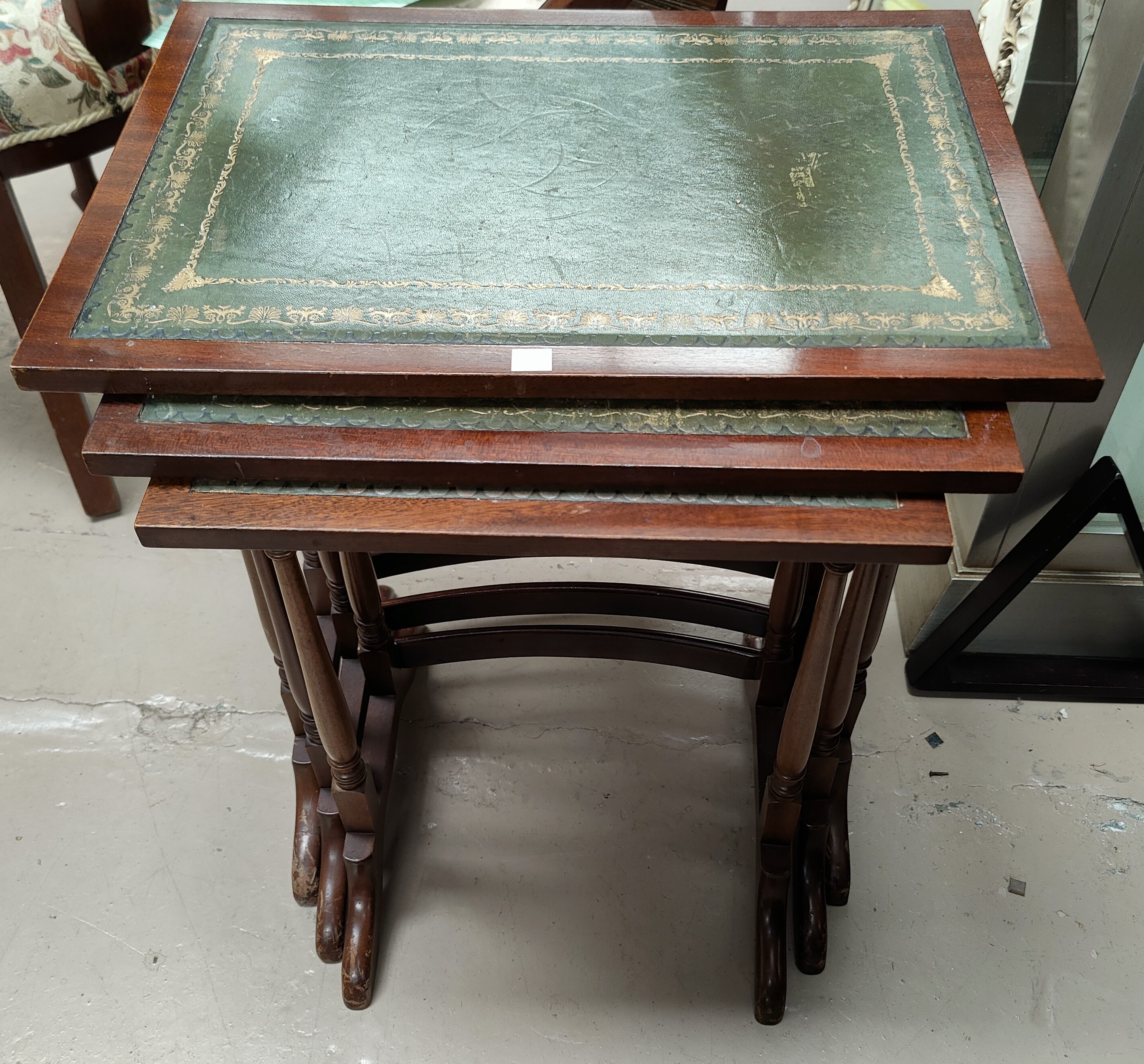 A reproduction mahogany nest of 3 trio tables; a wine table with octagonal top