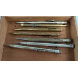 Various vintage silvered and gilt cased pencils