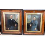A pair of bird's eye maple veneered frames containing three quarter length overpainted portraits
