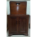 A 1930's drinks cabinet with fall front upper section over double cupboard