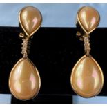 A pair of Christian Dior drop earrings with opal effect centres with gilt surrounds with coloured