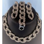 A "The Kooples" suite of jewellery comprising of a heavy silvered and clear stone linked necklace,