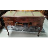 A modern reproduction mahogany kneehole desk with inset top and 5 drawers, on cabriole legs