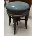 A Victorian piano stools with revolving seats