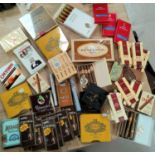 A large collection of cigars, some boxes unopened, some partially opened and some empty boxes