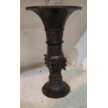 A Chinese bronze vase with wide flared rim decoration in relief, height 42cm (no base)