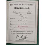 A German Socialist Labour Front membership card signed and dated 1938 and stamped up to 1944