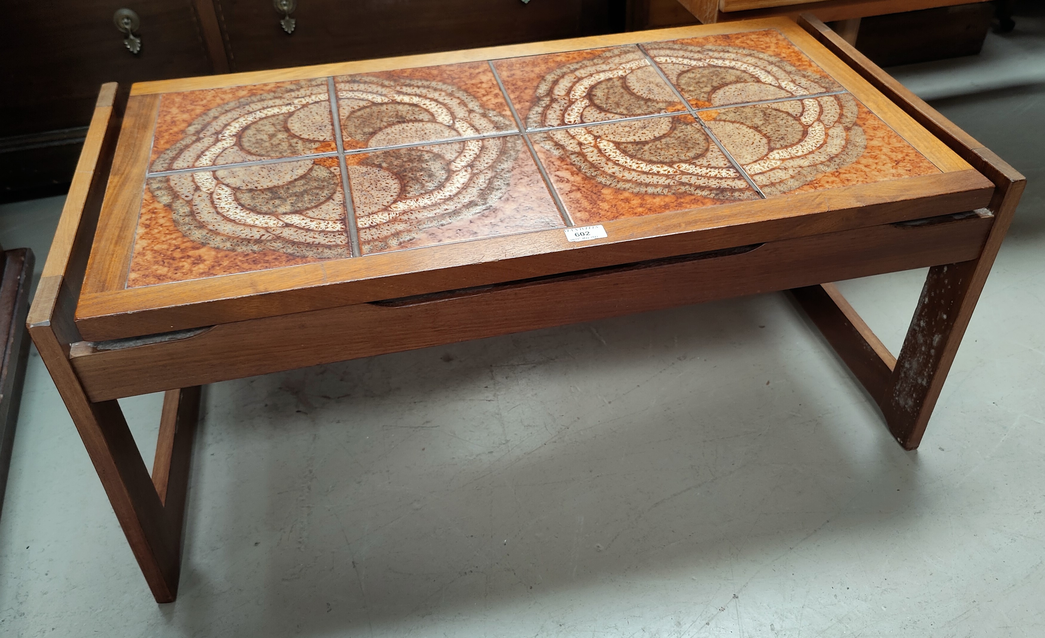 A 1960's teak coffee table with tile top