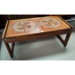 A 1960's teak coffee table with tile top