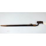 A BRITISH 19th century socket bayonet and brass mounted leather scabbard, probably for an Enfield