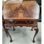 A period style burr walnut 'bureau de dame' with frieze drawer, on cabriole legs