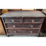 A Victorian stained pine chest of 2 long and 2 short drawers (back a.f)