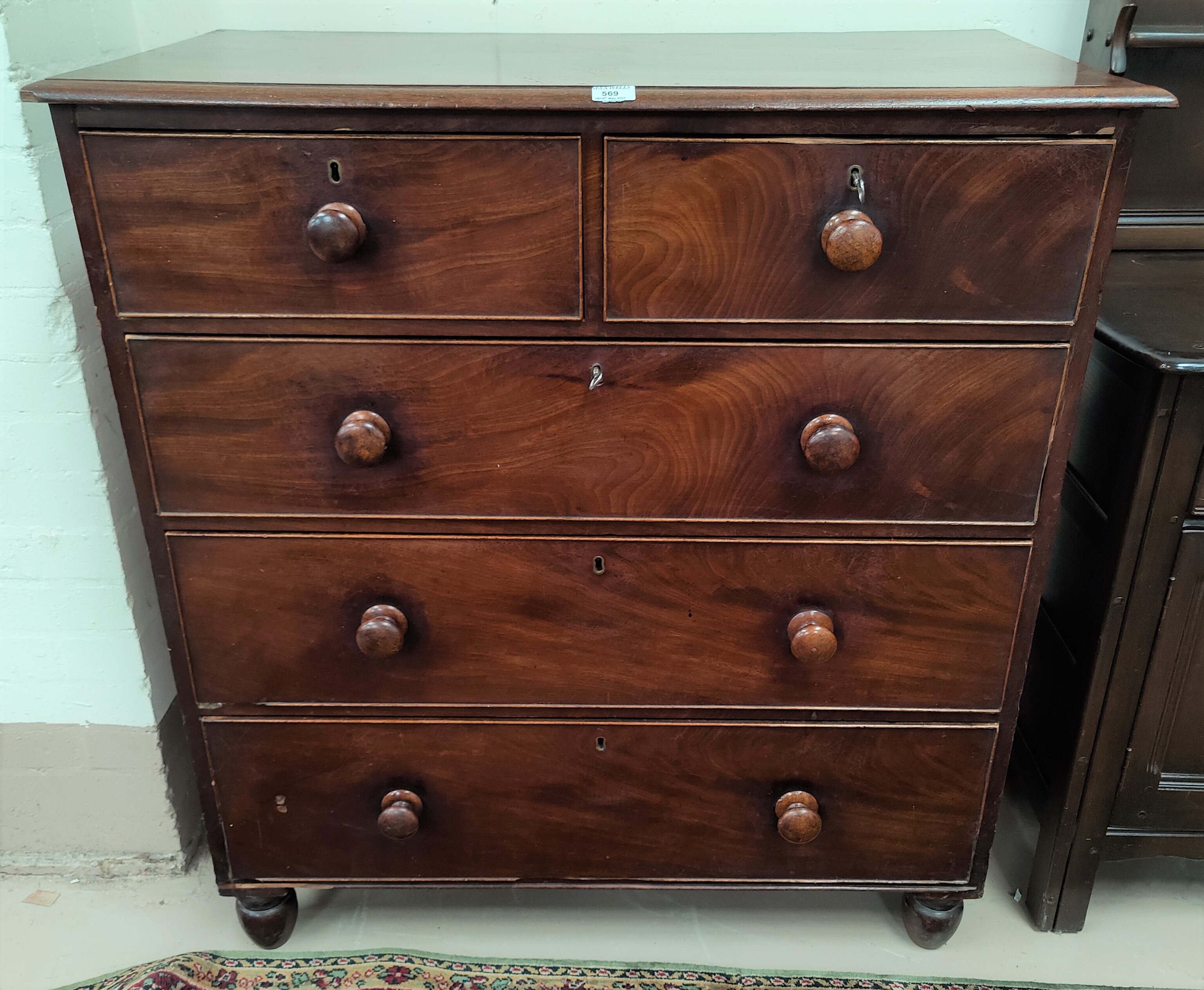 A Victorian mahogany chest of 3 long and 2 short drawers, with knob handles
