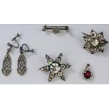 A Victorian hallmarked silver and foiled paste set star brooch Birmingham 1899, a later similar gilt