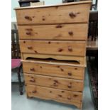 A modern pine pair of 3 height chests of drawers