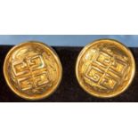 A pair of Givenchy gilt circular earrings with stylized Givenchy symbol to centre