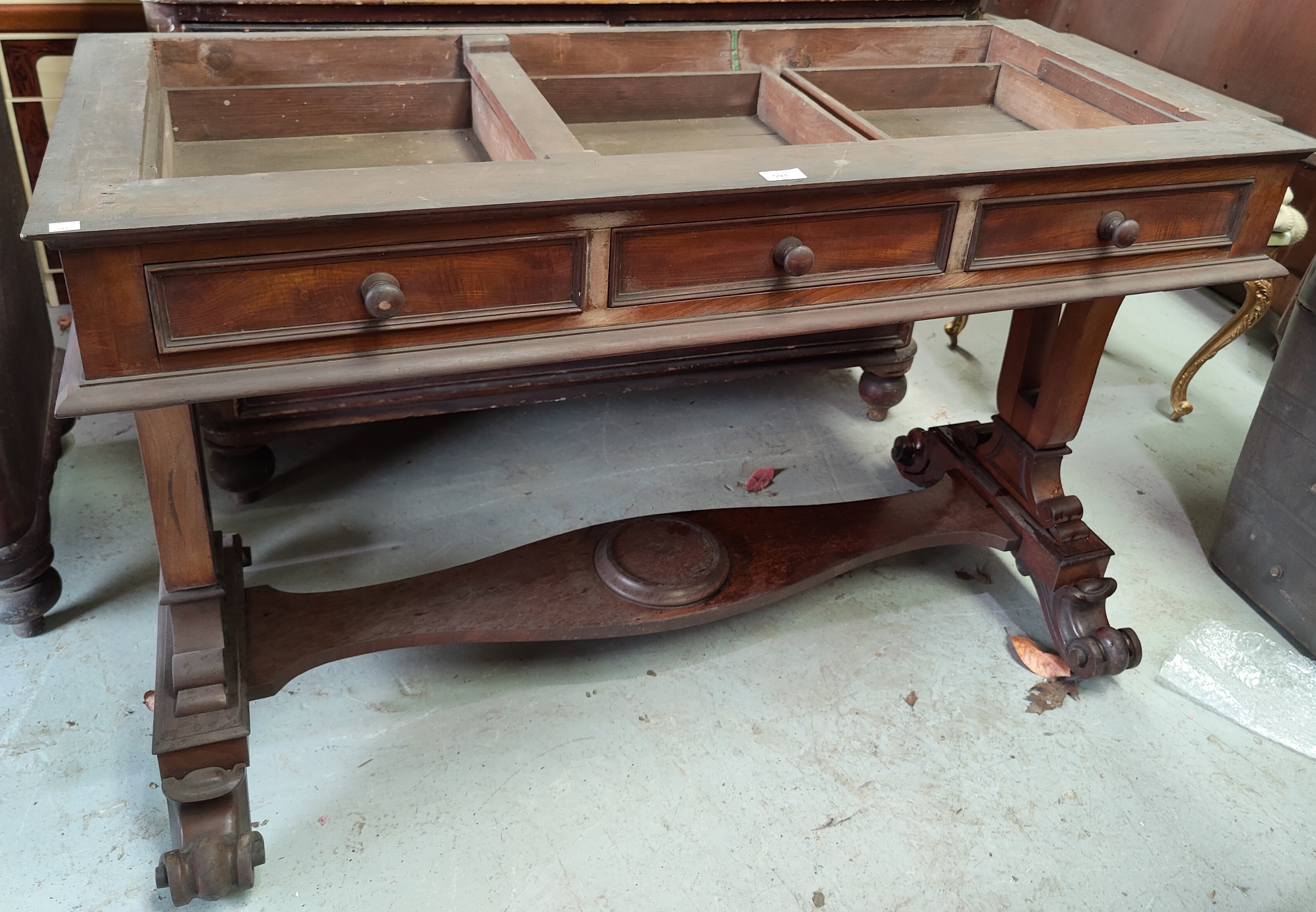 A Victorian mahogany side table/washstand with 3 frieze drawers, pierced end supports, on scroll