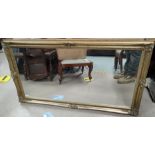 A large gilt framed rectangular mirror, H: 74 x L:135cm