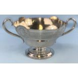 A continental two handled pedestal rose bowl with inscribed Greek key and cherub head border on a