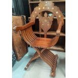 A Middle Eastern brass inlaid throne chair with floral inlay to back and arms