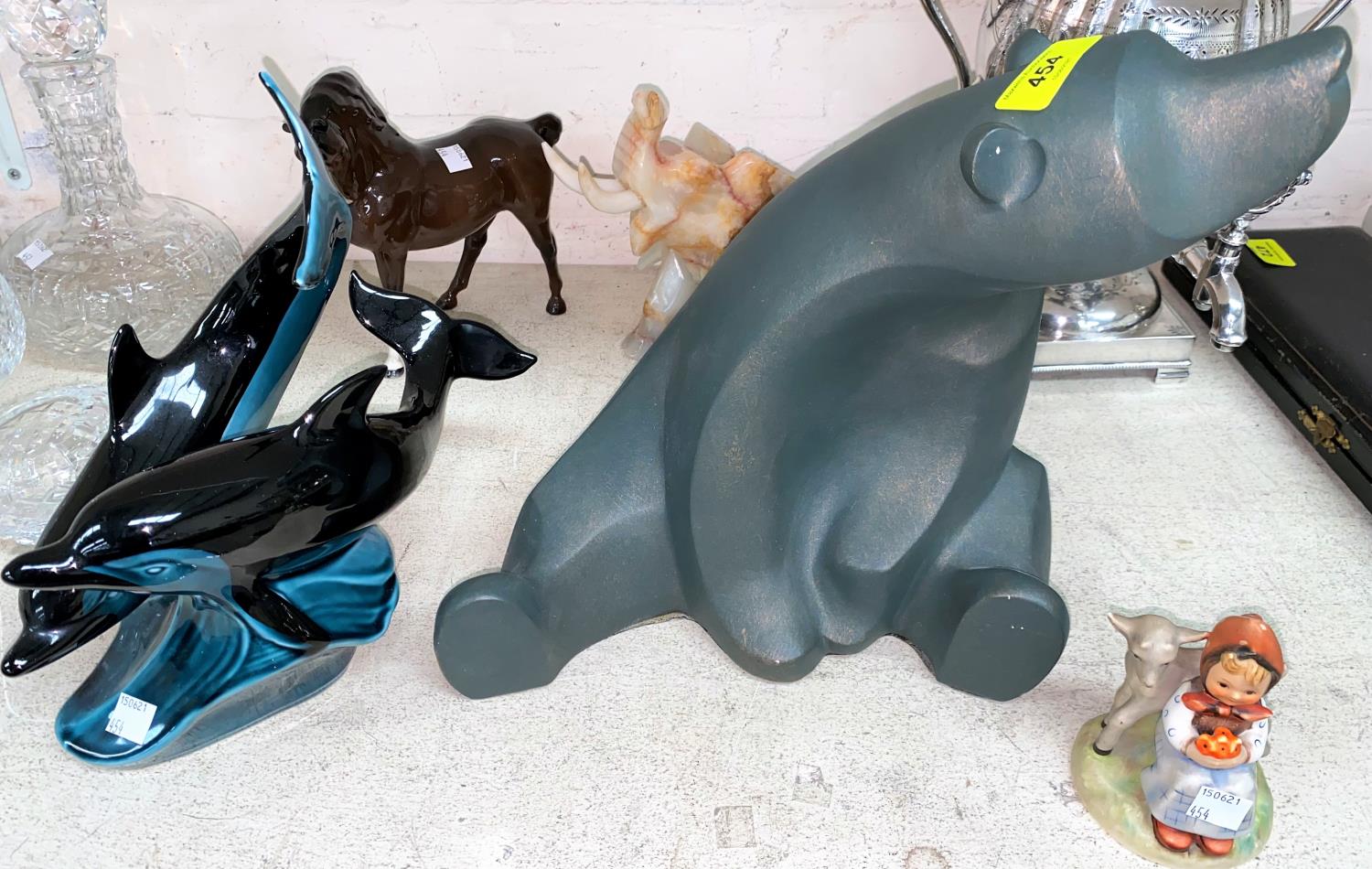 A Beswick horse; a Poole dolphin group etc