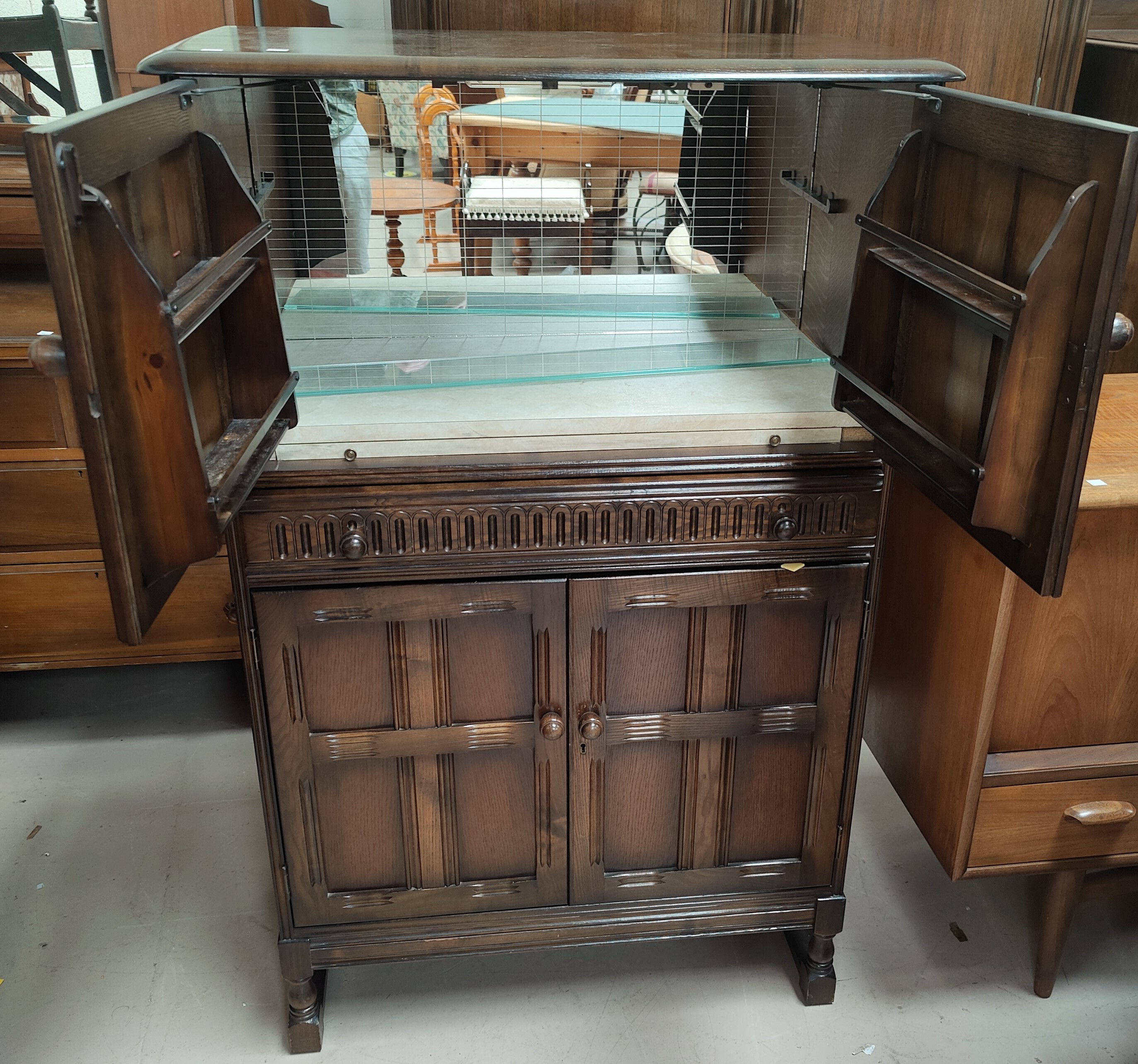 An Ercol traditional style cocktail cabinet, fitted cupboards and central drawer, 82 cm - Image 2 of 2