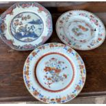 Three 18th / 19th century Chinese dishes with polychrome floral and animal decorations, diameter