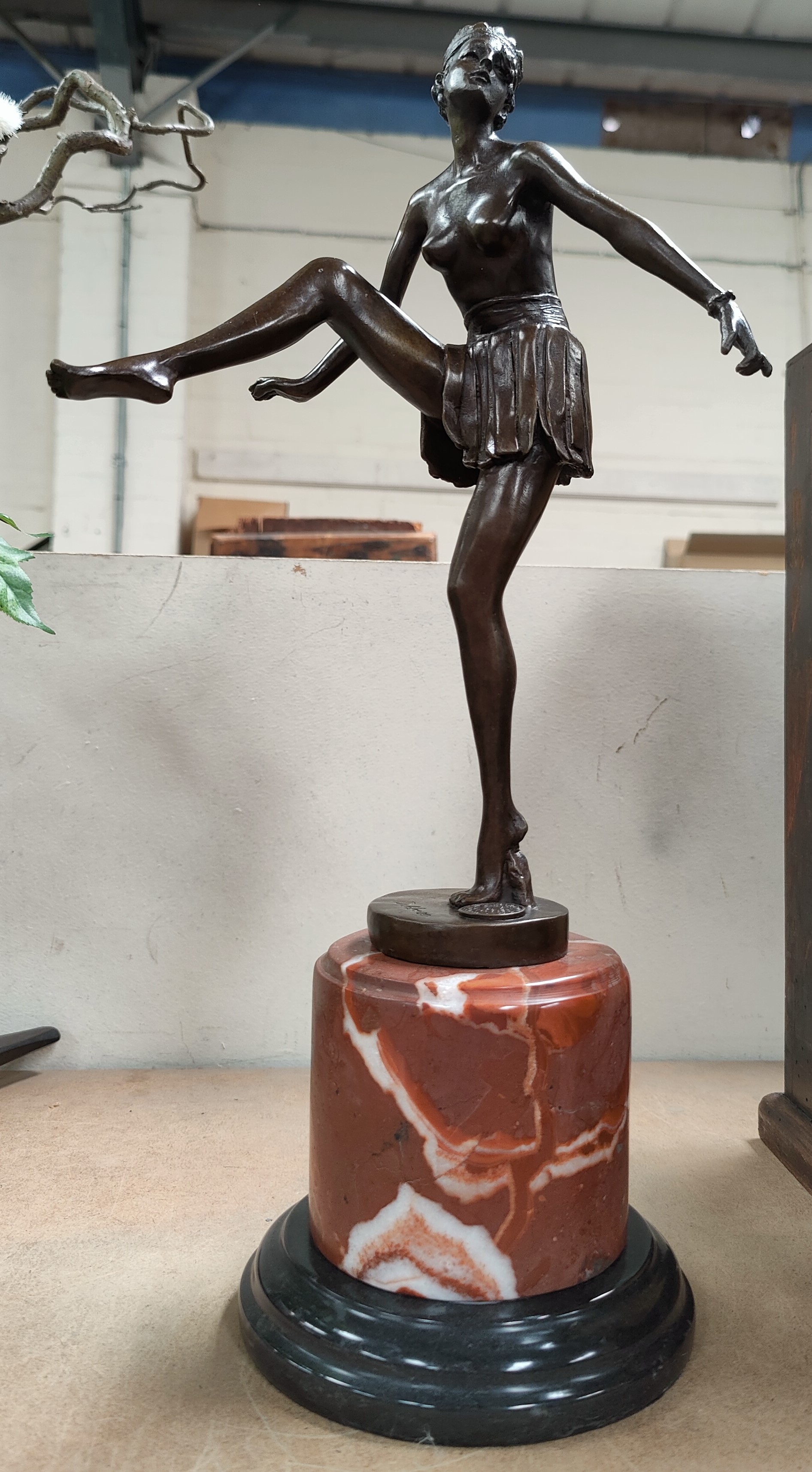 An Art Deco style bronze of semi clad woman dancing, back signed D Alonzo with plaque, on marble