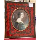 An oval miniature: half length portrait of a noblewoman, in boullework frame, 14 x 12 cm overall