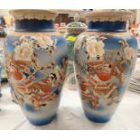 A large pair of Japanese Satsuma vases decorated with warriors, height 38cm (one rim and neck