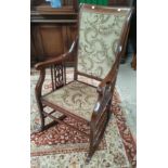 An Edwardian mahogany rocking chair, inlaid stringing decoration