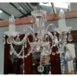An antique crystal chandelier of 3 branches