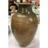 A Chinese stone ware baluster vase with tea dust coloured ground with incised decoration height 23cm