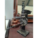 A vintage microscope with side measure